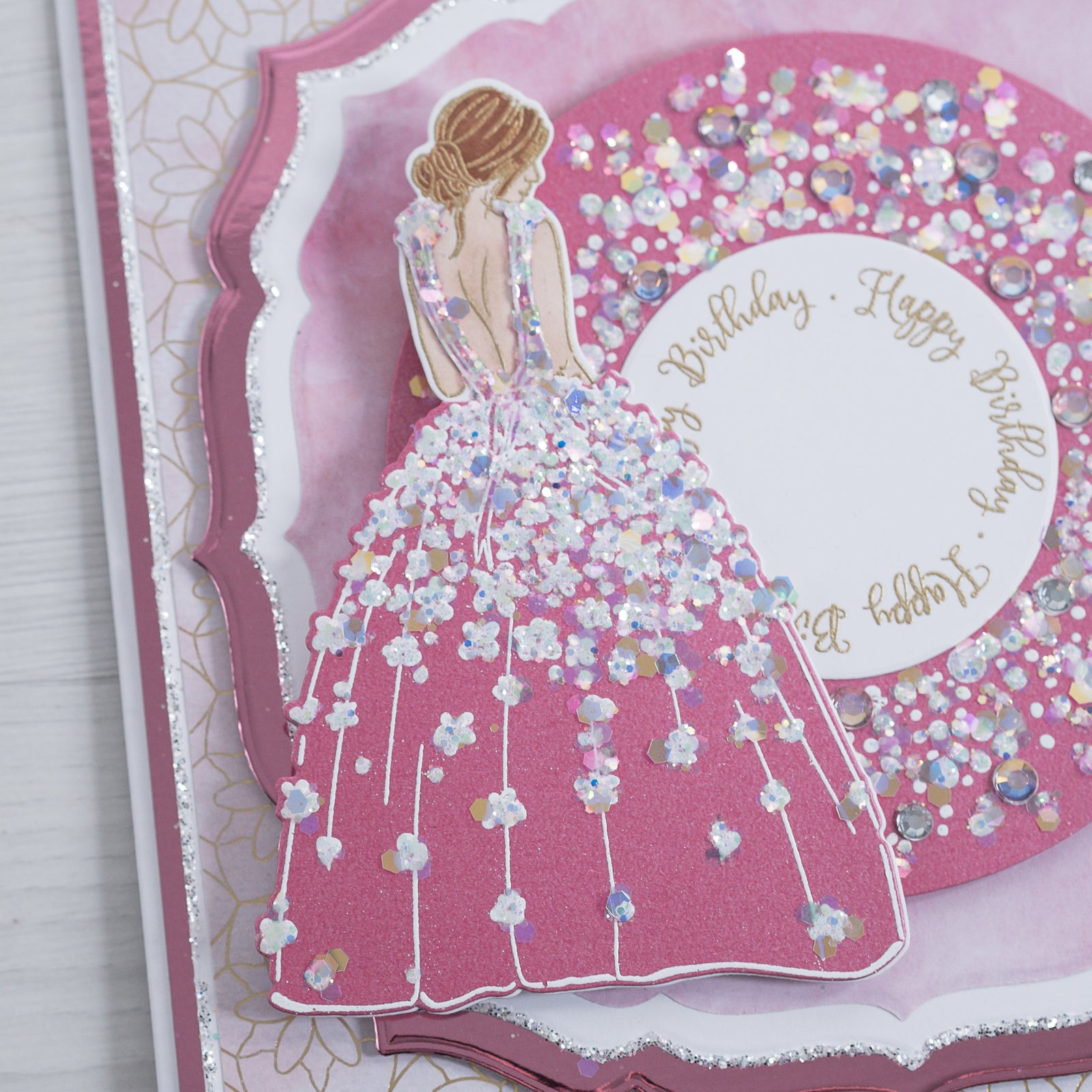Learn how to make this sparkling pink card using our new Floral Dress stamp to create the silhouette of a lady in a beautiful gown. This card would make the perfect birthday card or wedding card.