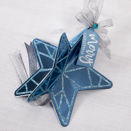 Learn how to make this blue card and sparkling glitter 3D star decoration for your Christmas Tree with this free craft tutorial from Chloes Creative Cards.