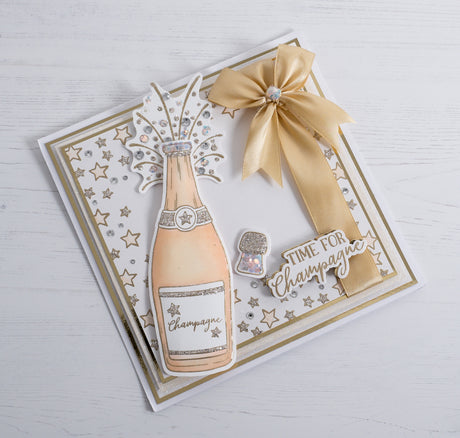 Celebrate a special moment like an engagement by making this beautiful free card-making tutorial. This modern peach and gold themed cards features a bow ribbon detail and our new 3D champagne bottle stamp element with star embossed details.