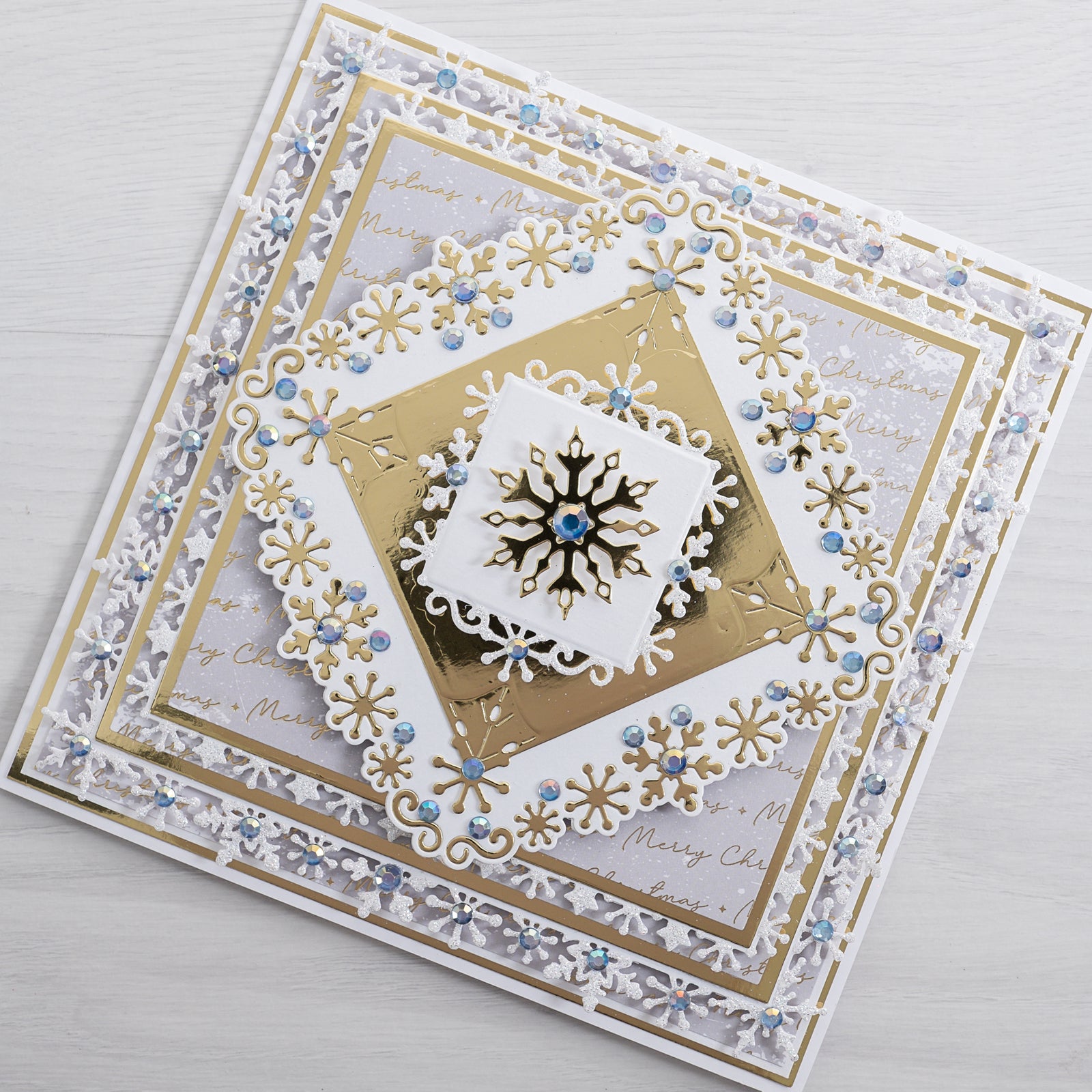 Learn how to create this stunning swirly snowflake Christmas card using the new Snowflake Frames Die Set and Swirly Snowflake Flurry Die and Stamp Set from Chloes Creative Cards.